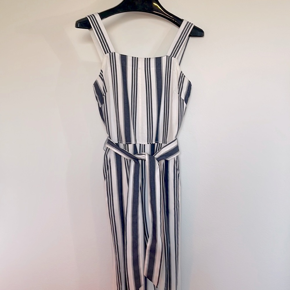 Cute Jumpsuit in white with navy stripes.